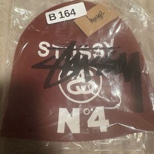 Stussy Maroon Beanie with White Logo and Black Graphic